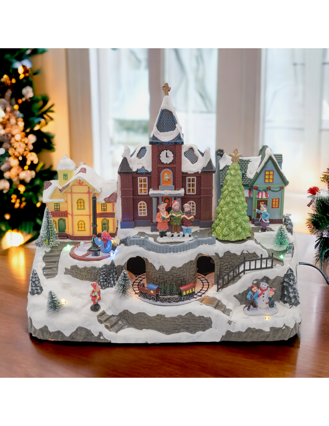 GIOSTRINE E VILLAGGI: vendita online Villaggio di Natale Innevato con Chiesa 34x27cm, Trenino e Giostra Rotanti, Albero Lumin...