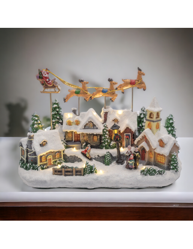 GIOSTRINE E VILLAGGI: vendita online Villaggio di Natale Innevato con Chiesa 34x23cm, Babbo Natale su Slitta Volante, Renne i...